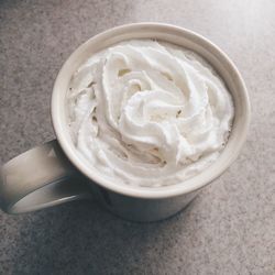 High angle view of coffee with whipped cream in cup