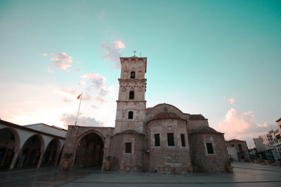 Historic temple against sky in city