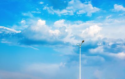 Low angle view of street light against sky