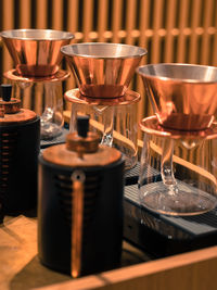 Close-up of coffee cups on table