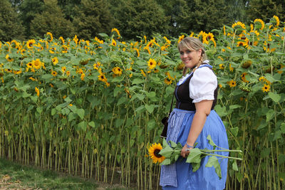 Full length of girl standing on flower