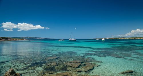 Scenic view of sea against blue sky