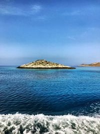 Scenic view of sea against blue sky