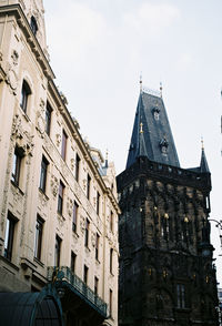 Low angle view of buildings against sky in city