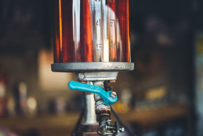 Close-up of glass container in dark room