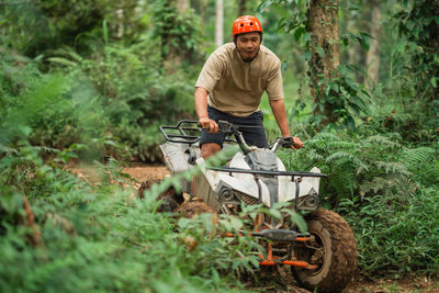 Rear view of man working on field