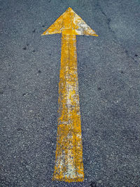 Yellow arrow symbol on road