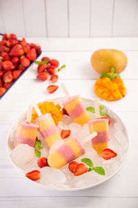 High angle view of fruits in plate on table