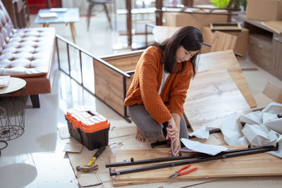 Portrait of young woman working at home