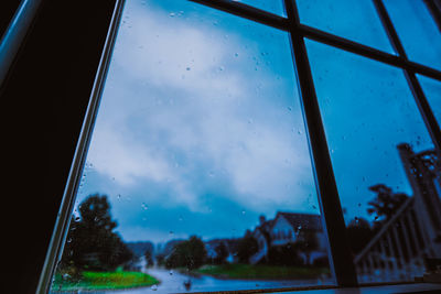 View of city street seen through wet window