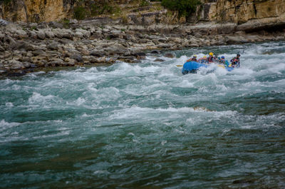 People surfing in sea