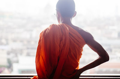 Rear view of man standing against sky