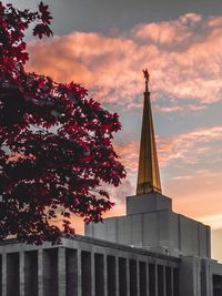 Low angle view of building against cloudy sky