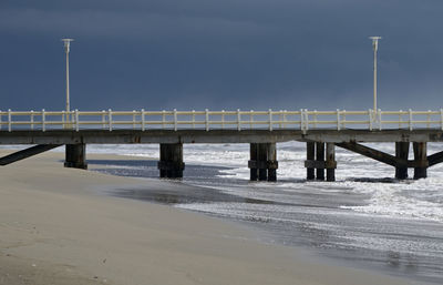 Bridge over sea against sky