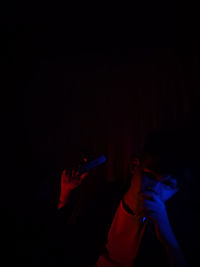 Portrait of young man in darkroom