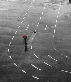 High angle view of man walking on road