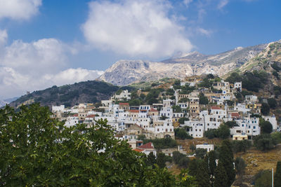 Buildings in town against sky