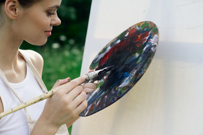 Midsection of woman holding bouquet