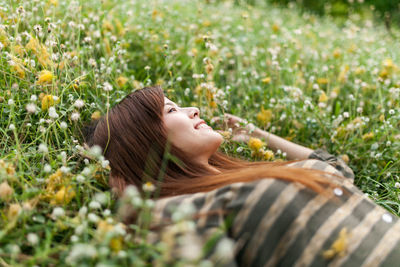 Woman lying on field