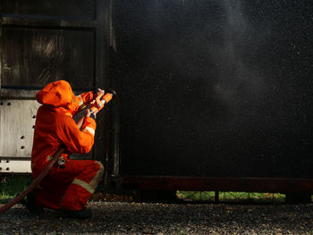 Side view of man working at night