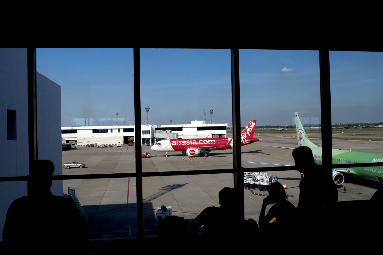 VIEW OF AIRPORT AND AIRPLANE WINDOW