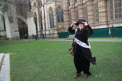 Full length of woman standing in park