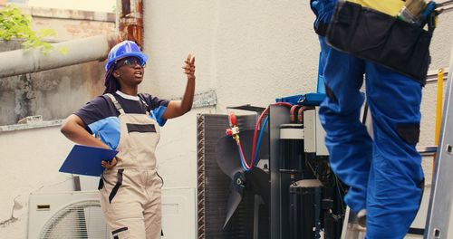 Rear view of man working at construction site