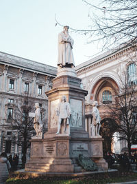 Low angle view of statue against building