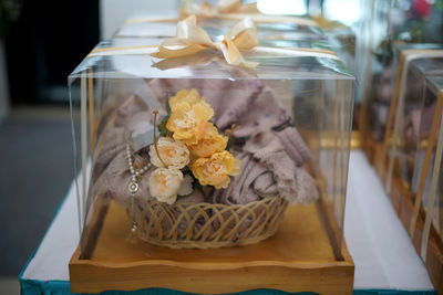 Close-up of food and wedding gift on table