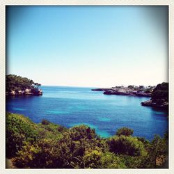 Scenic view of sea against clear sky