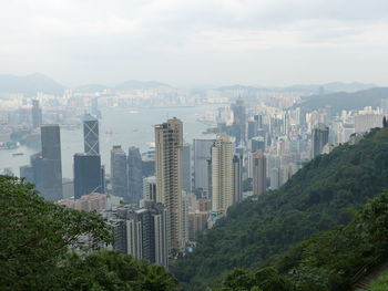 View of city against cloudy sky