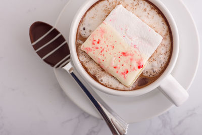 High angle view of coffee cup on table