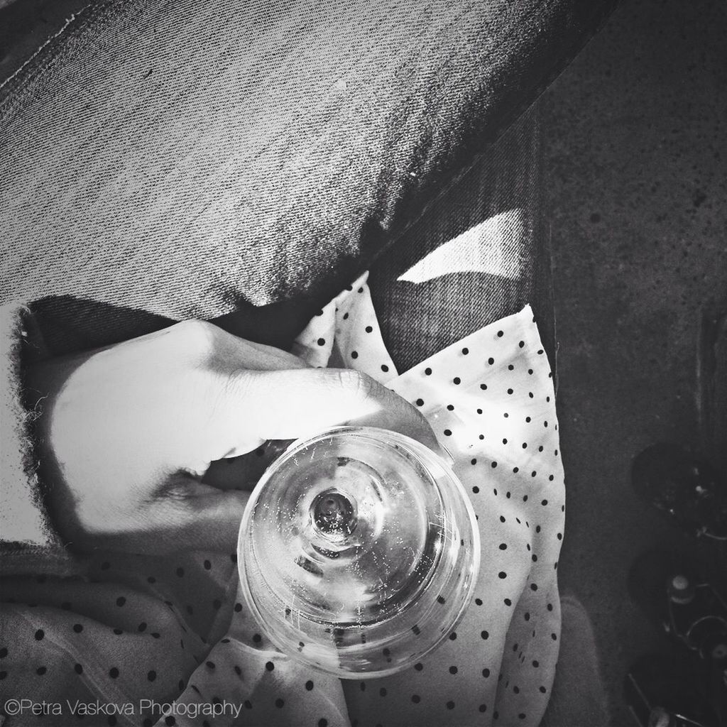 high angle view, indoors, animal themes, one animal, low section, relaxation, domestic animals, resting, close-up, pets, lifestyles, person, leisure activity, lying down, sunlight, shoe, mammal, day