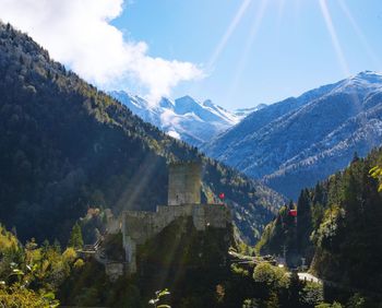 Panoramic view of trees and buildings against sky