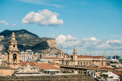 Buildings in city against sky