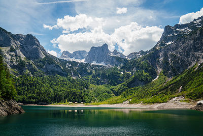A big mountain at the end of a mountain lake.