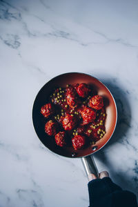 High angle view of strawberries in bowl