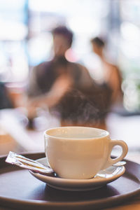 Coffee cup on table at cafe