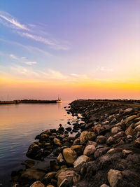 Scenic view of sea against sky during sunset