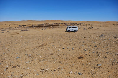 View of car on desert land