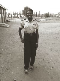 Full length portrait of young man standing outdoors