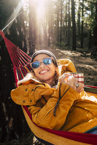 Portrait of smiling young man wearing sunglasses