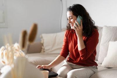 Young woman using mobile phone