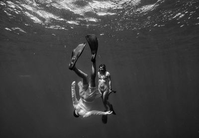Man and woman swimming in sea