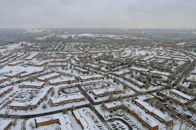 High angle view of buildings in city against sky