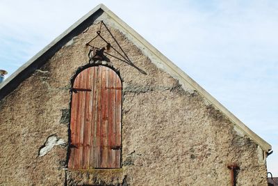 Low angle view of old building against sky