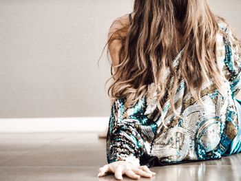 Full length of woman sitting in hair