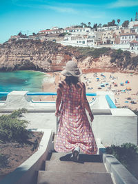 Rear view of woman looking at sea