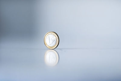 Close-up of clock on green background