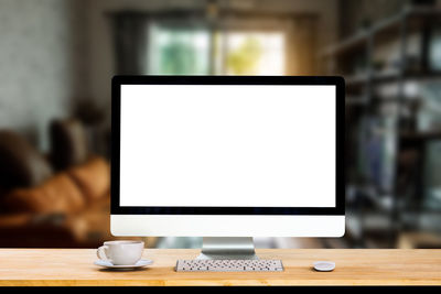 Close-up of coffee cup on table